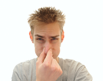 Young man holding his breath